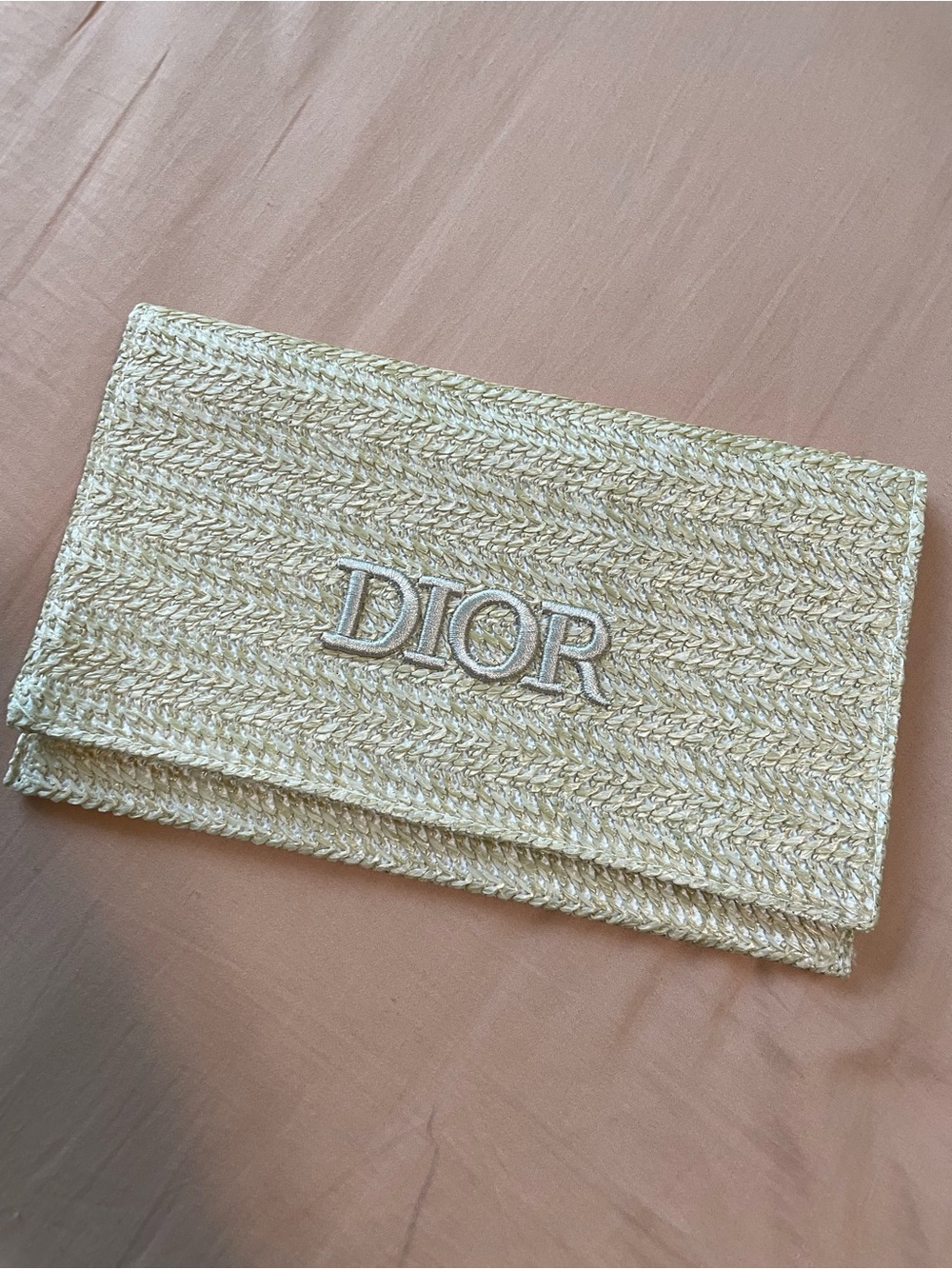 Dior straw cosmetic pouch
